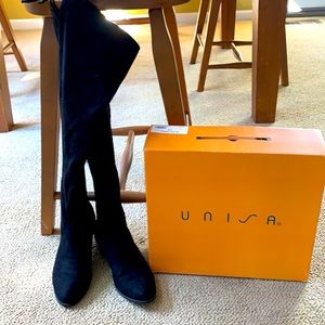 Tall black suede boots with ties to tighten at the calf. Size 8